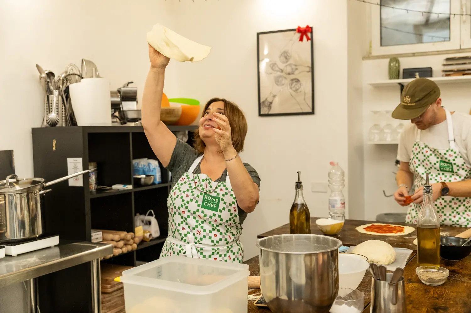 Woman enjoying wine and appetizers at elegant Pizza & Tiramisu Class tasting event