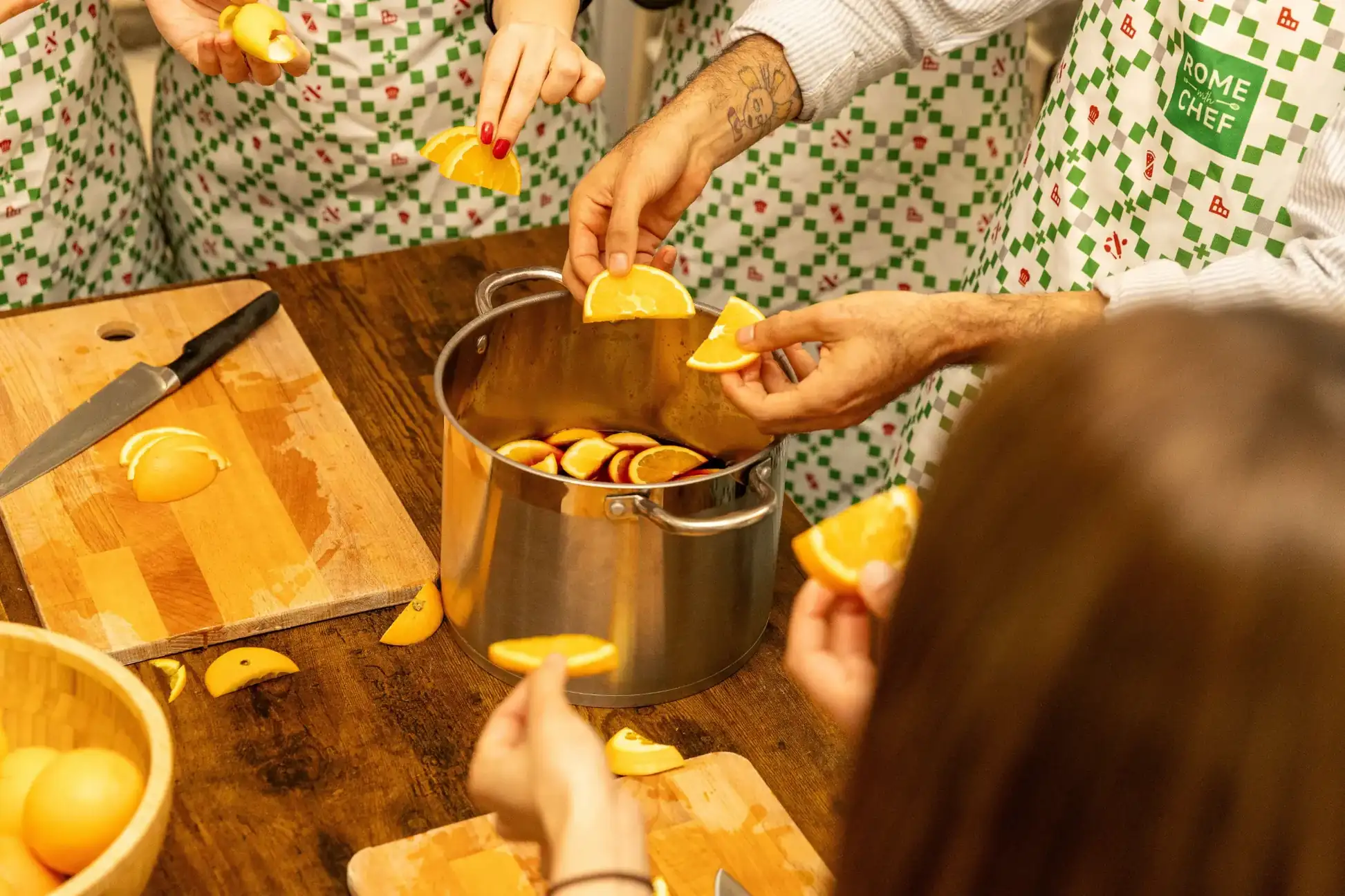 students-adding-oranges-to-pot
