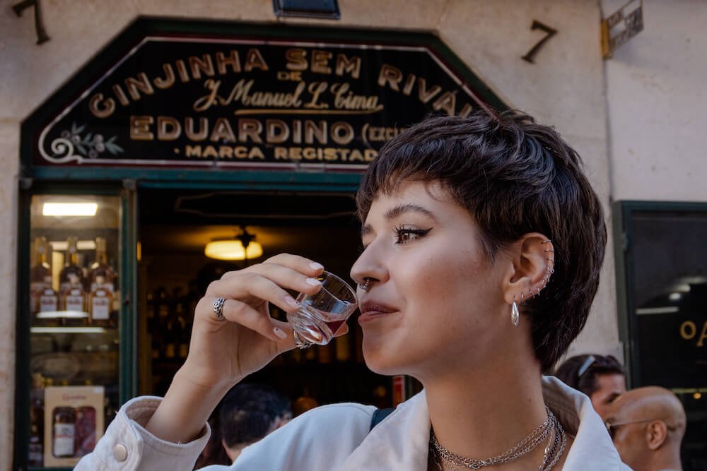 What is Ginjinha? This young woman is finding our on a Tipsy Food Tour of Lisbon