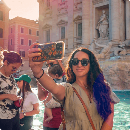 Snapping a selfie at the Trevi Fountain