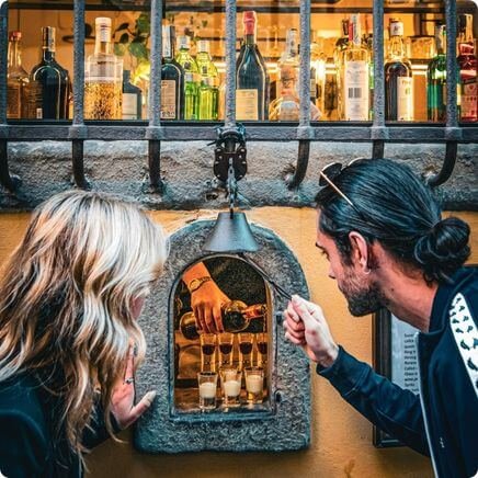 Couple outside a Florence Wine Window