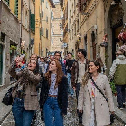 Girls walking through Florence on a Florence hen do